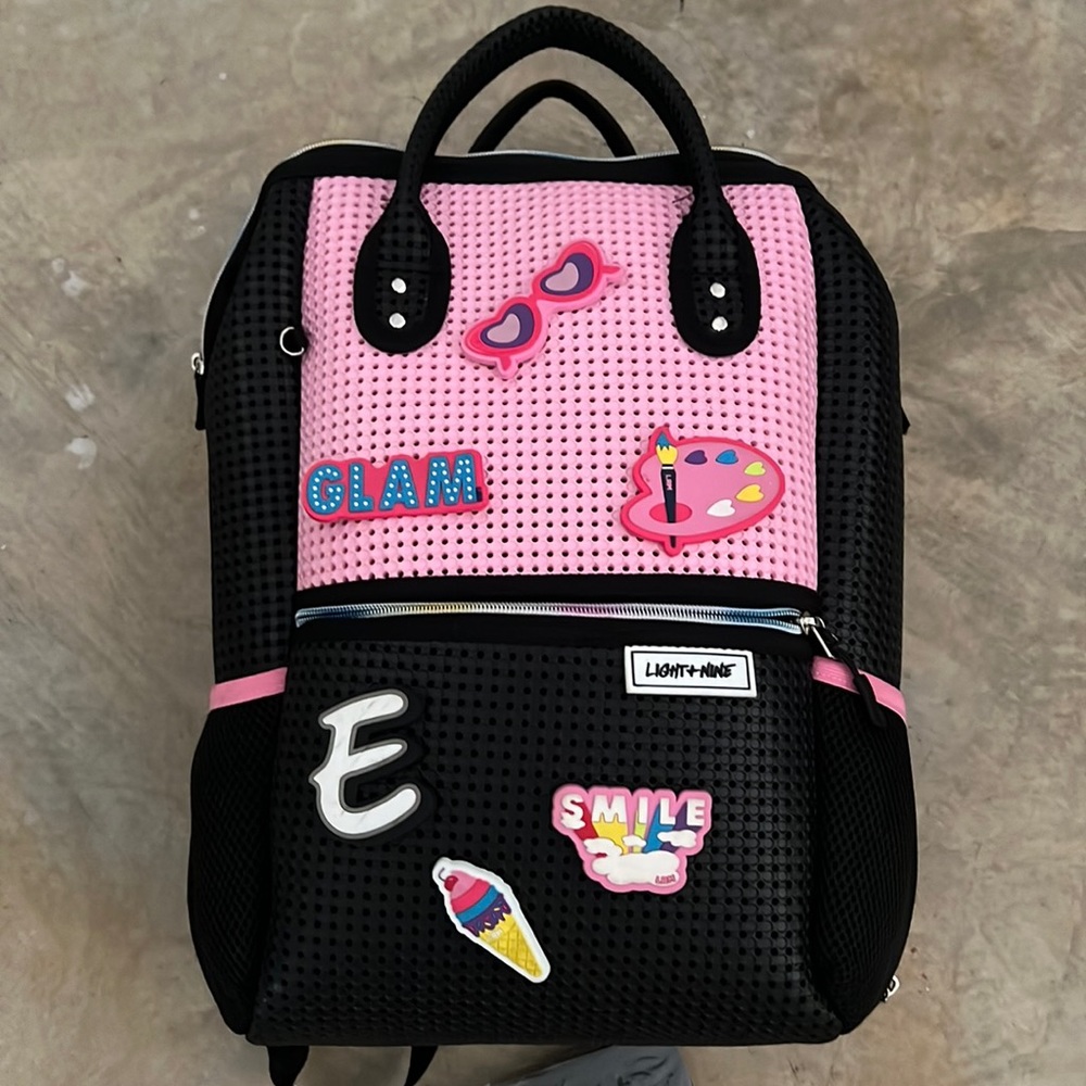 Light+ line back pack with extra charms! Worn one time !